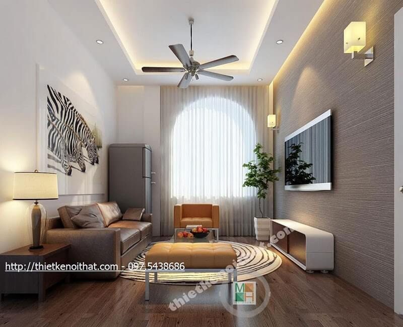 . Để làm cho bức tường không còn bị thô cứng mà lại tạo được điểm nhấn cho phòng khách, hãy sử dụng tranh treo tường và giấy dán tường màu xám.